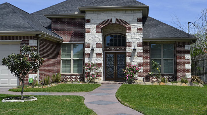 A landscaped and manicured front walkway.